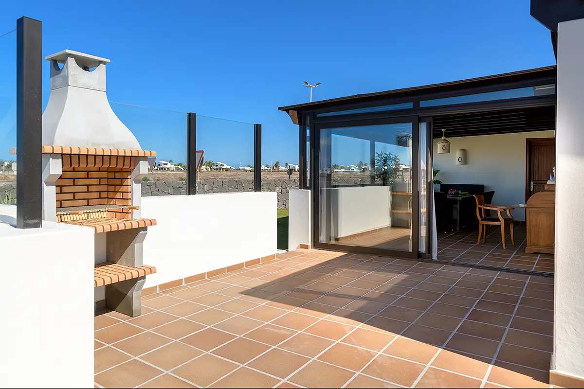 Terrace with barbecue at Hipoclub Villa Aguamarina 1