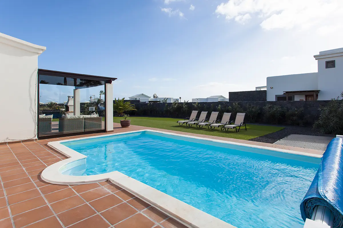 Swimming pool next to the terrace and porch at Hipoclub Villa Zafiro 34