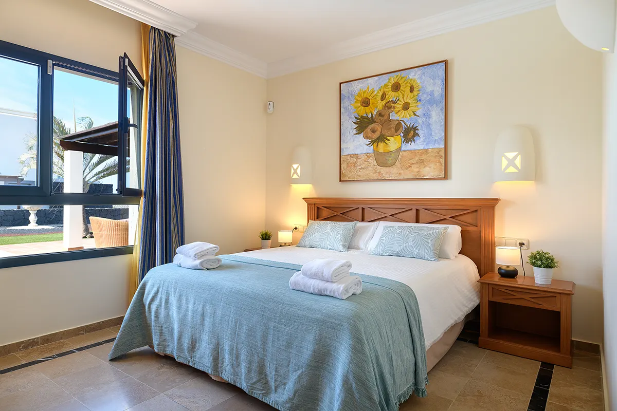 Bedroom with garden views at Hipoclub Villa Aguamarina 1