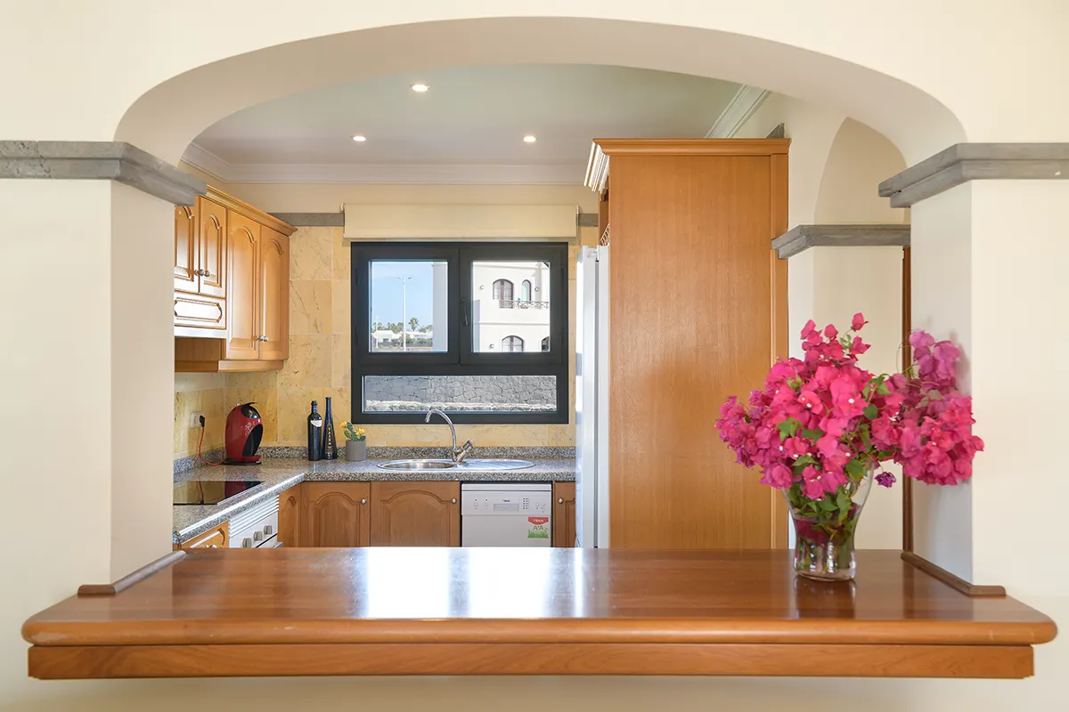 Serving hatch from the kitchen at Hipoclub Villa Aguamarina 1