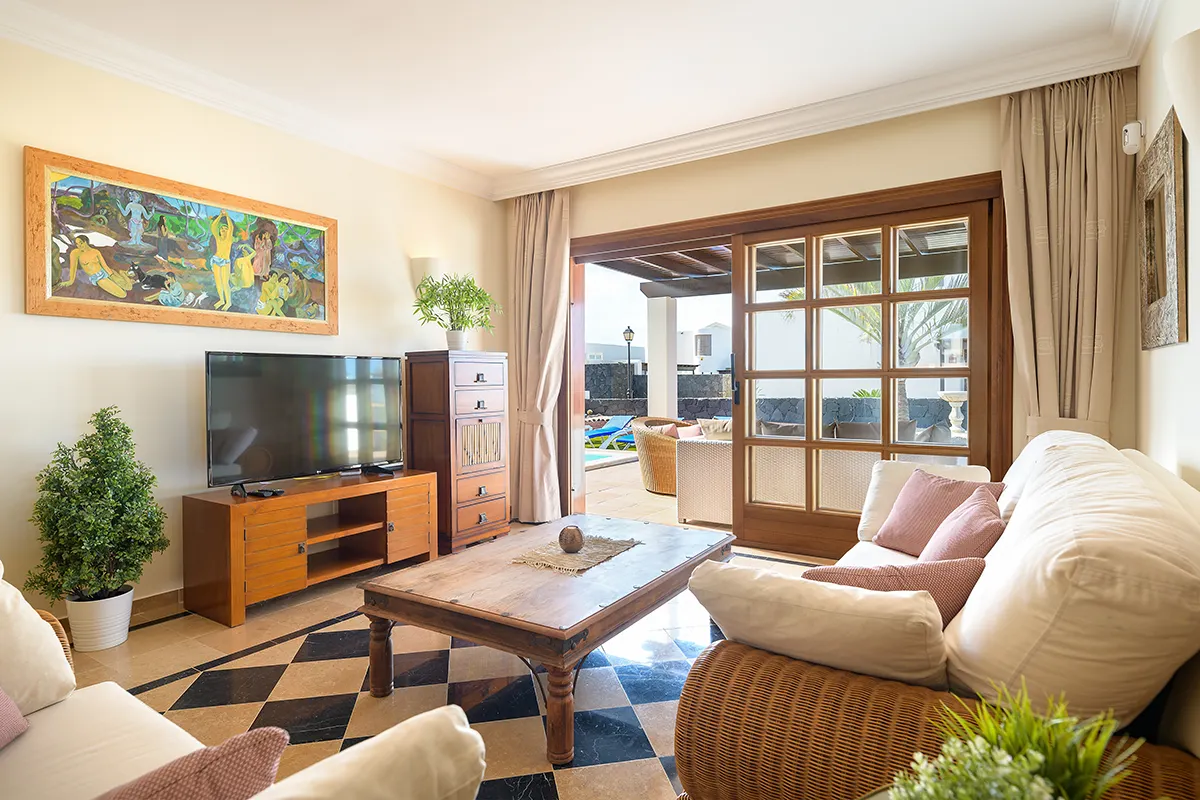 Living room with television at Hipoclub Villa Aguamarina 1