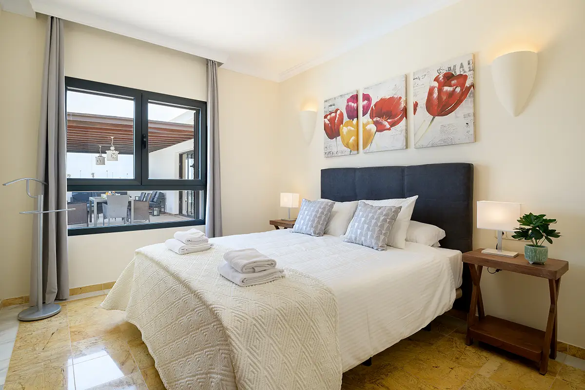 Double bedroom with terrace views at Villa Faro Park 189 Hipoclub