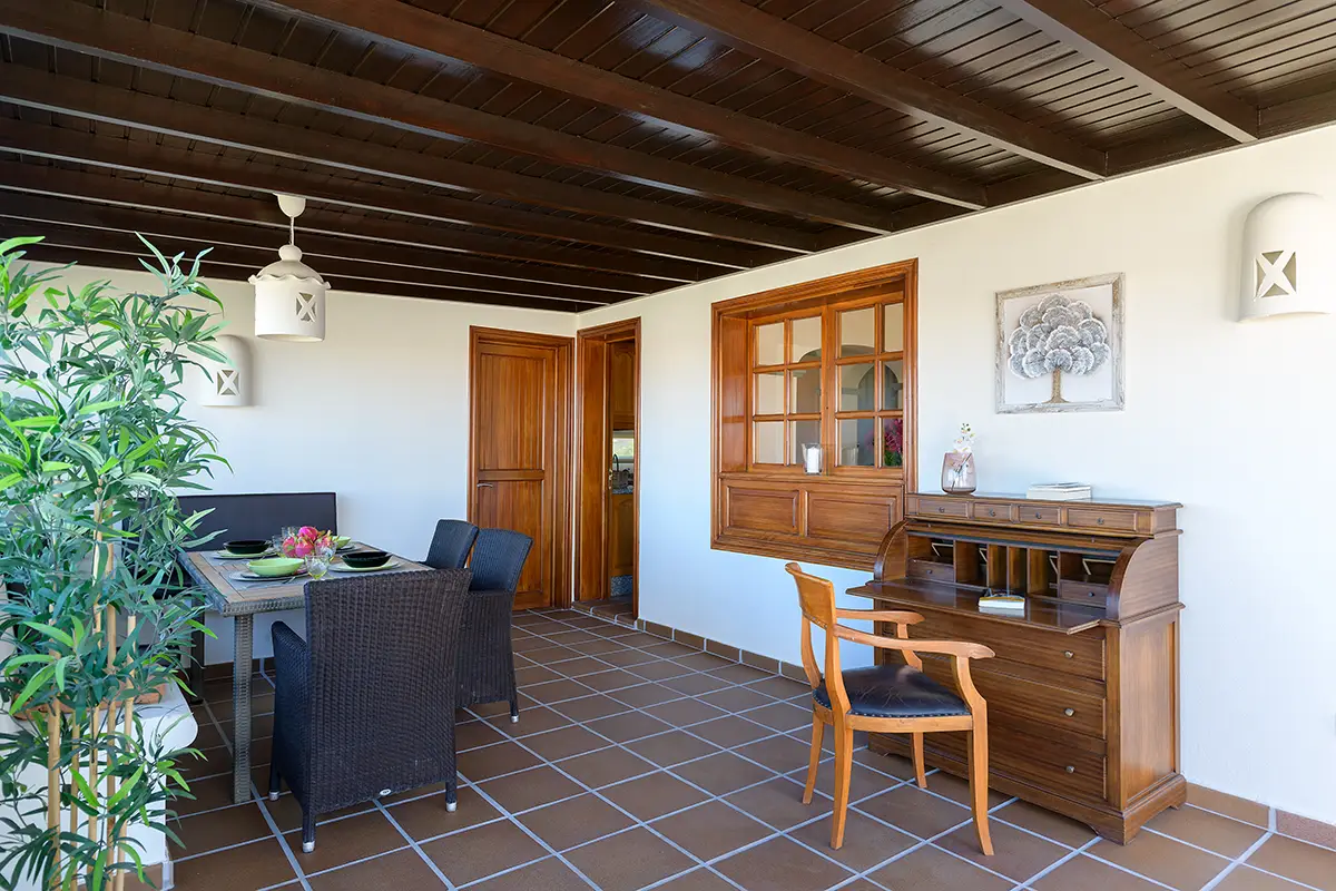 Covered terrace with desk area at Hipoclub Villa Aguamarina 1
