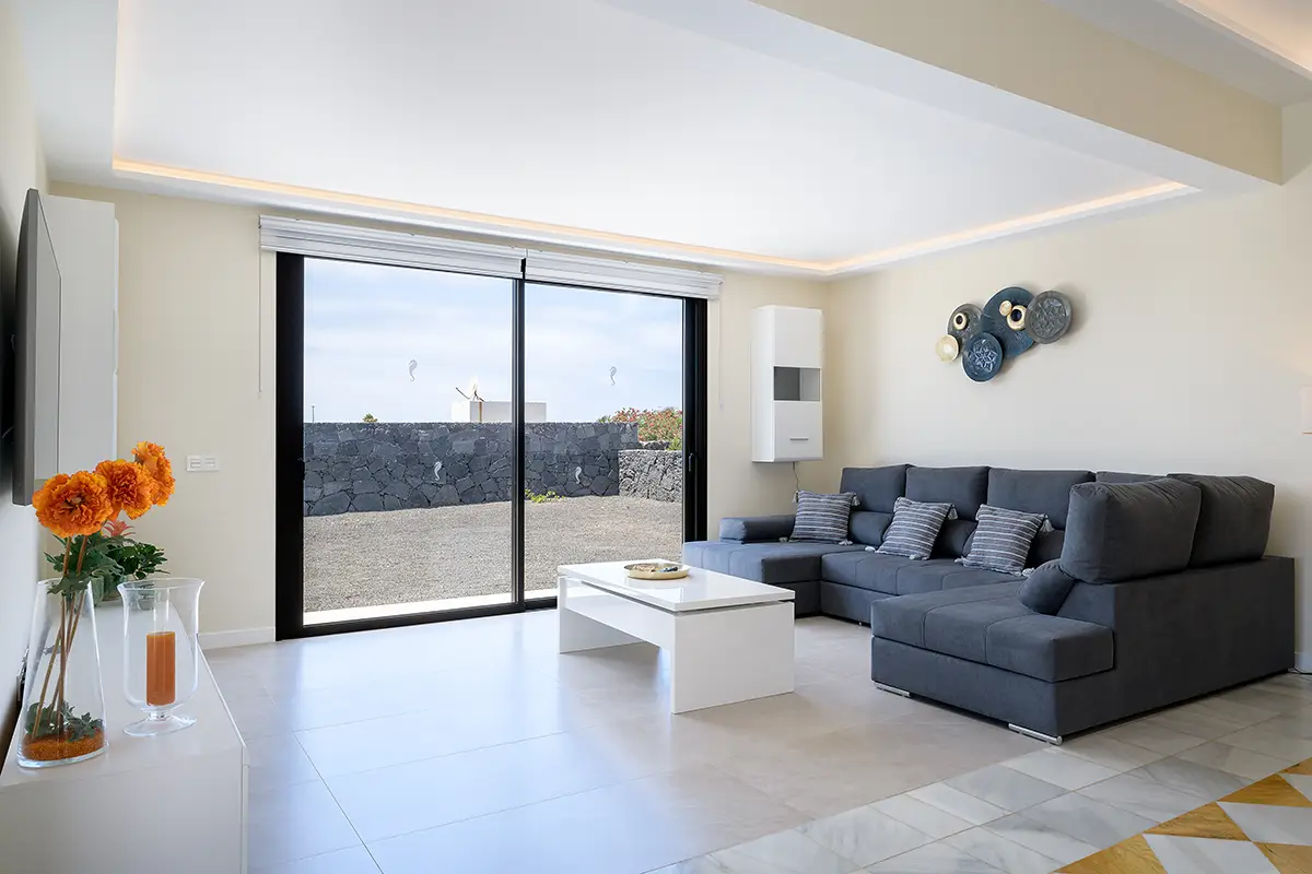 Living room with television and direct access to the terrace at Villa Faro Park 189 Hipoclub