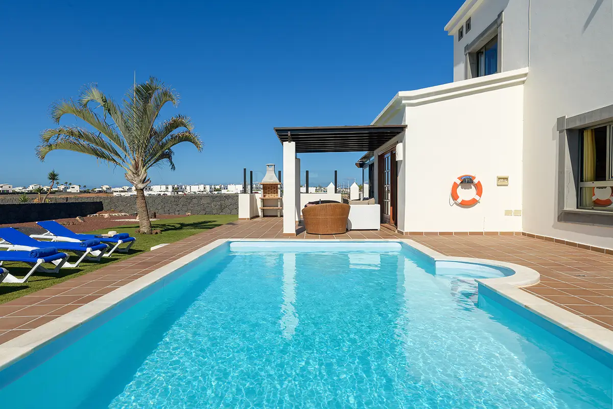 Swimming pool next to the terrace at Hipoclub Villa Aguamarina 1