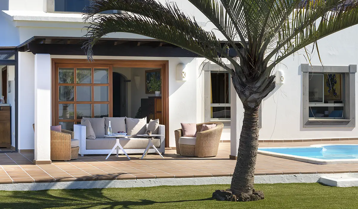 Terrace by the garden Terrace with a comfortable outdoor sofa next to the garden