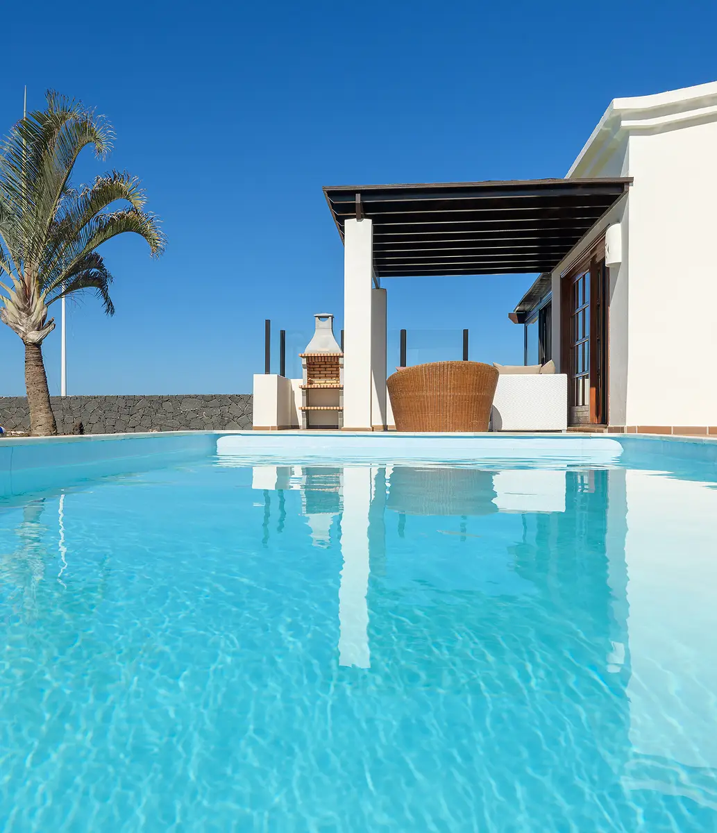 Pool and solarium Pool and solarium area at Hipoclub Villas